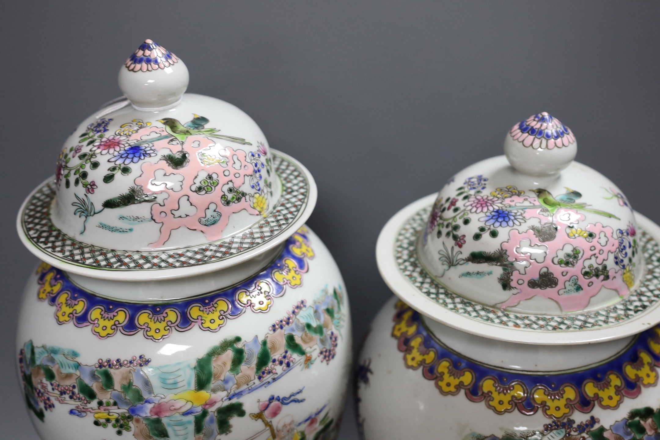 Two Chinese famille rose vases and covers, tallest 46cm high